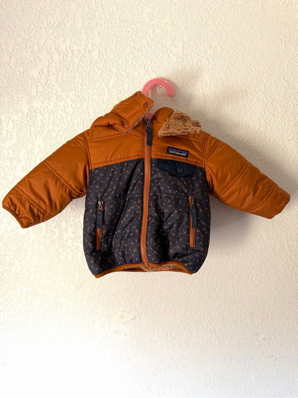 Patagonia Orange and Navy Kids Reversible Tribbles hooded Jacket